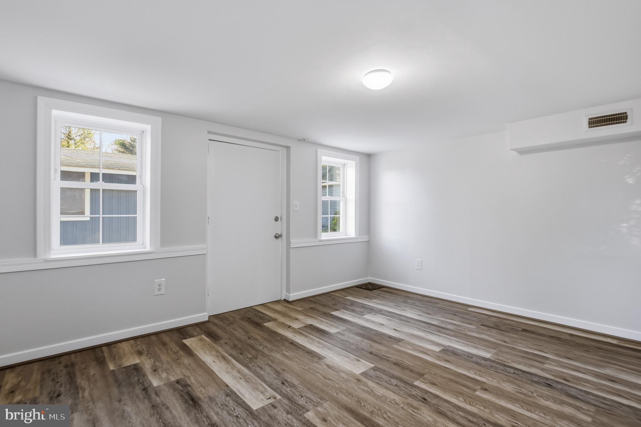 7365 Race Road Hanover, MD 21076 - Photo 42 of 68 a view of empty room with wooden floor and fan