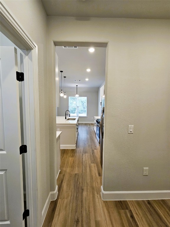 116 Pine Point Cove Elgin, TX 78621 - Photo 5 of 31 a view of a hallway with wooden floor