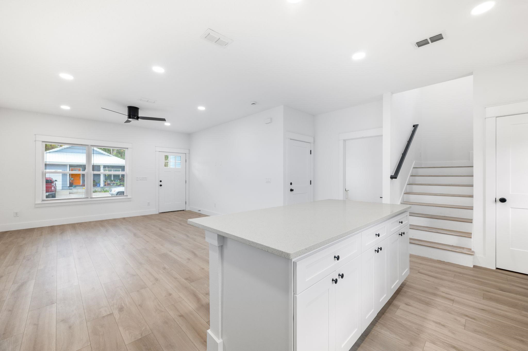 863 West 12th Street St. Augustine, FL 32084 - Photo 11 of 41 an empty room with wooden floor and windows