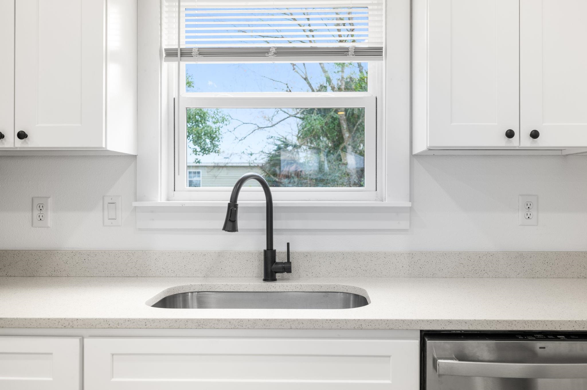 863 West 12th Street St. Augustine, FL 32084 - Photo 12 of 41 a kitchen with a sink and a window
