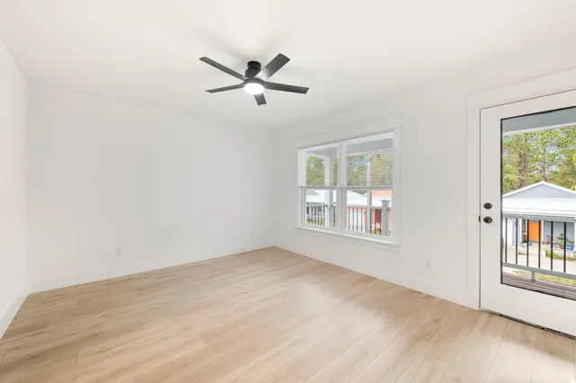 a view of an empty room with a window