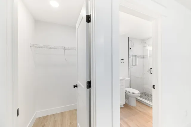 a bathroom with a granite countertop sink