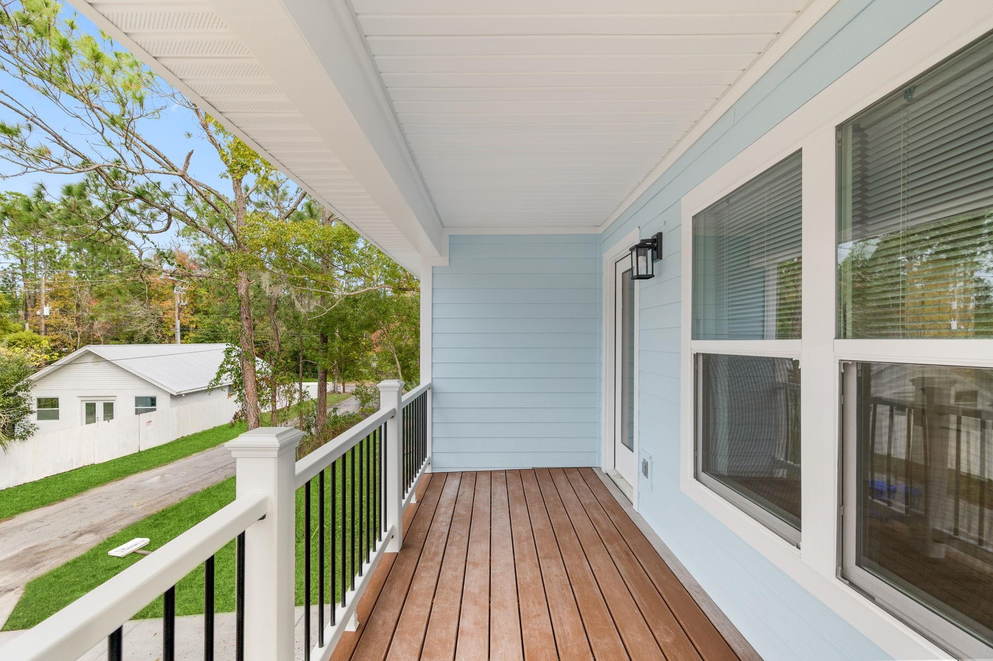 863 West 12th Street St. Augustine, FL 32084 - Photo 33 of 41 a view of a balcony with wooden floor and fence