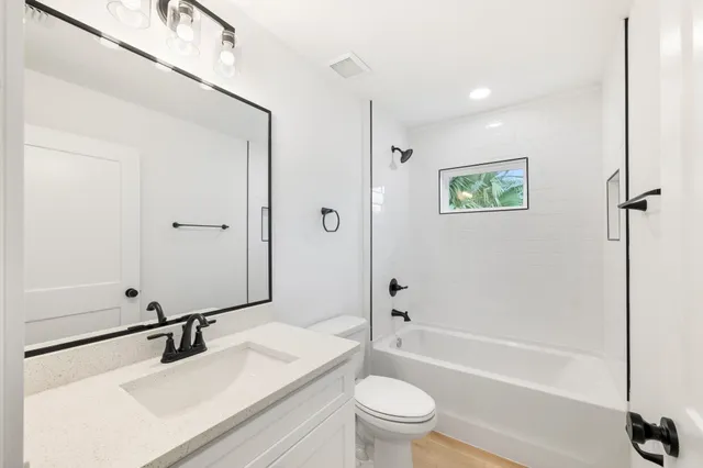a bathroom with a sink and mirror