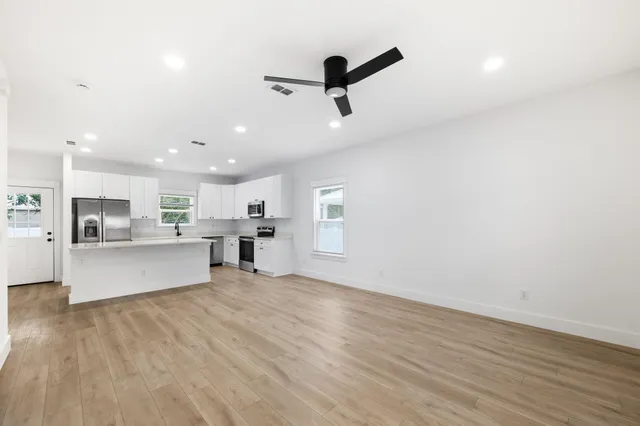 a view of kitchen with wooden floor and window