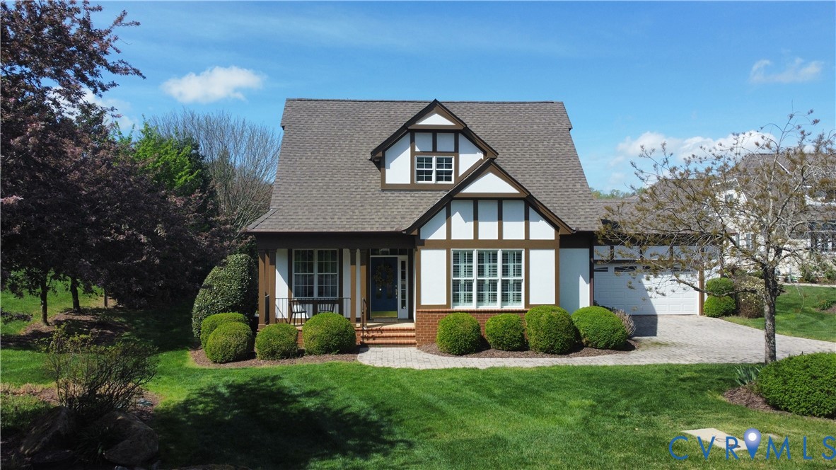 9012 Amberhill Loop North Chesterfield, VA 23236 - Photo 1 of 30 a front view of a house with a yard and trees