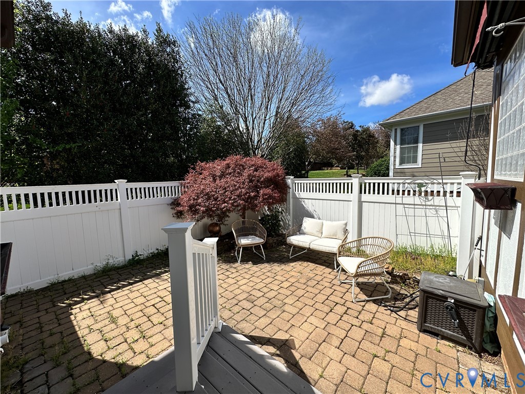 9012 Amberhill Loop North Chesterfield, VA 23236 - Photo 11 of 30 a view of a patio with two chairs and a table