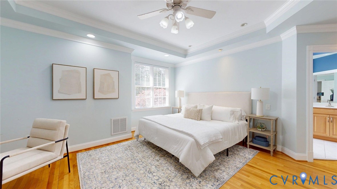 9012 Amberhill Loop North Chesterfield, VA 23236 - Photo 16 of 30 a bedroom with a bed and a chandelier
