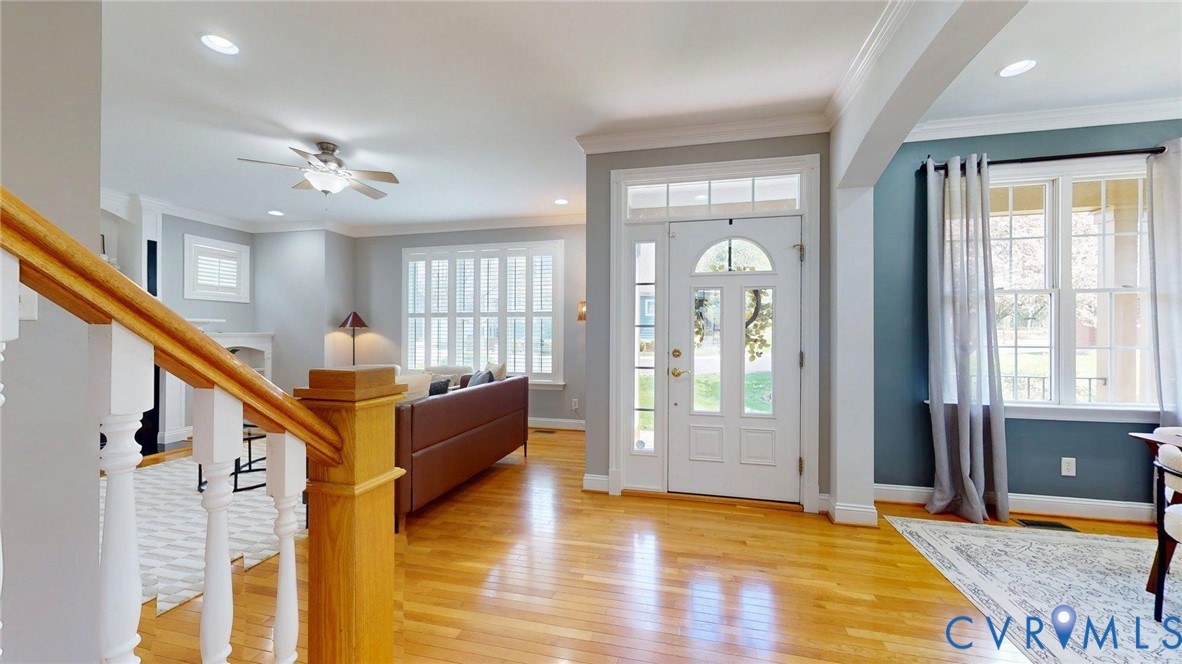 9012 Amberhill Loop North Chesterfield, VA 23236 - Photo 21 of 30 a view of an entryway with wooden floor and a livingroom