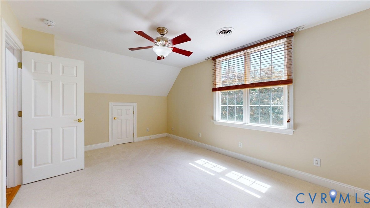 9012 Amberhill Loop North Chesterfield, VA 23236 - Photo 23 of 30 a view of an empty room with window and chandelier fan