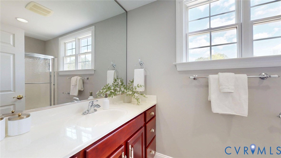 9012 Amberhill Loop North Chesterfield, VA 23236 - Photo 24 of 30 a bathroom with a sink vanity granite and a mirror