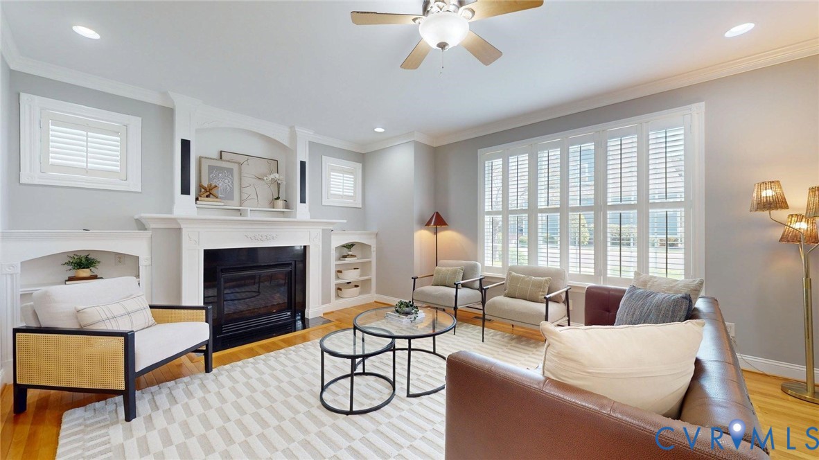 9012 Amberhill Loop North Chesterfield, VA 23236 - Photo 4 of 30 a living room with furniture a fireplace and a large window