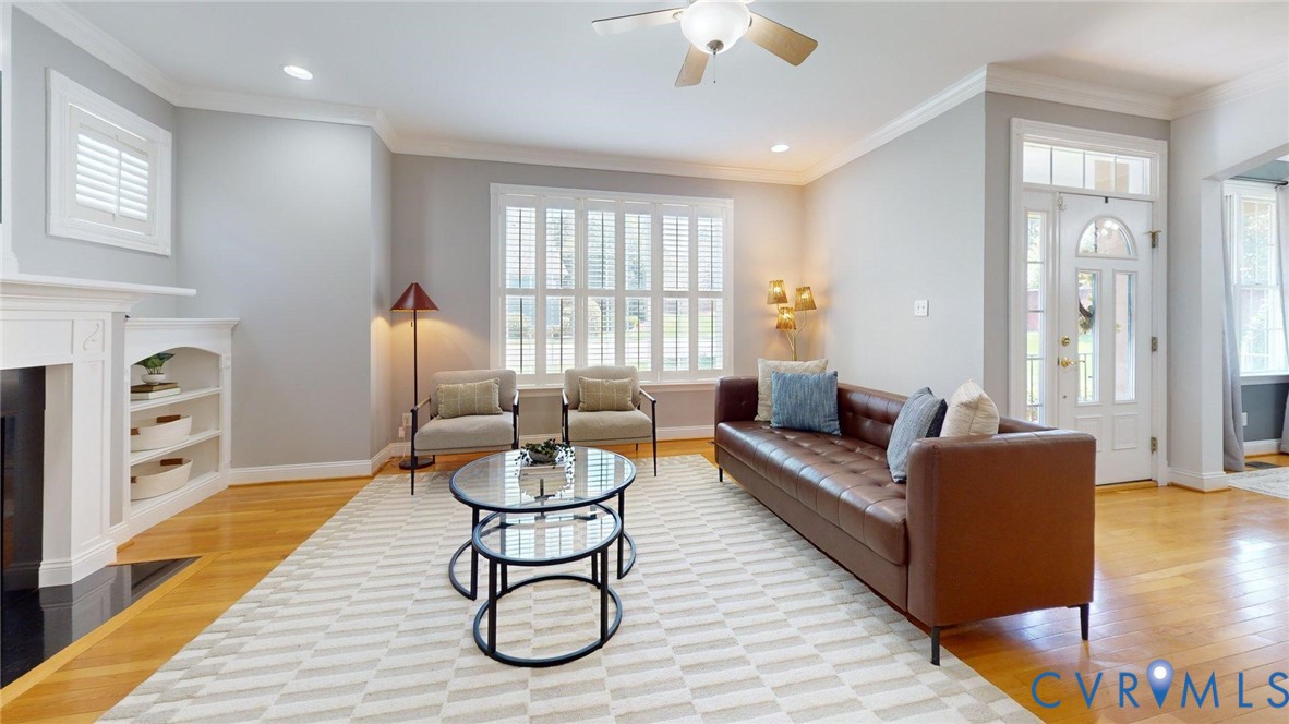 9012 Amberhill Loop North Chesterfield, VA 23236 - Photo 5 of 30 a living room with furniture a fireplace and wooden floor