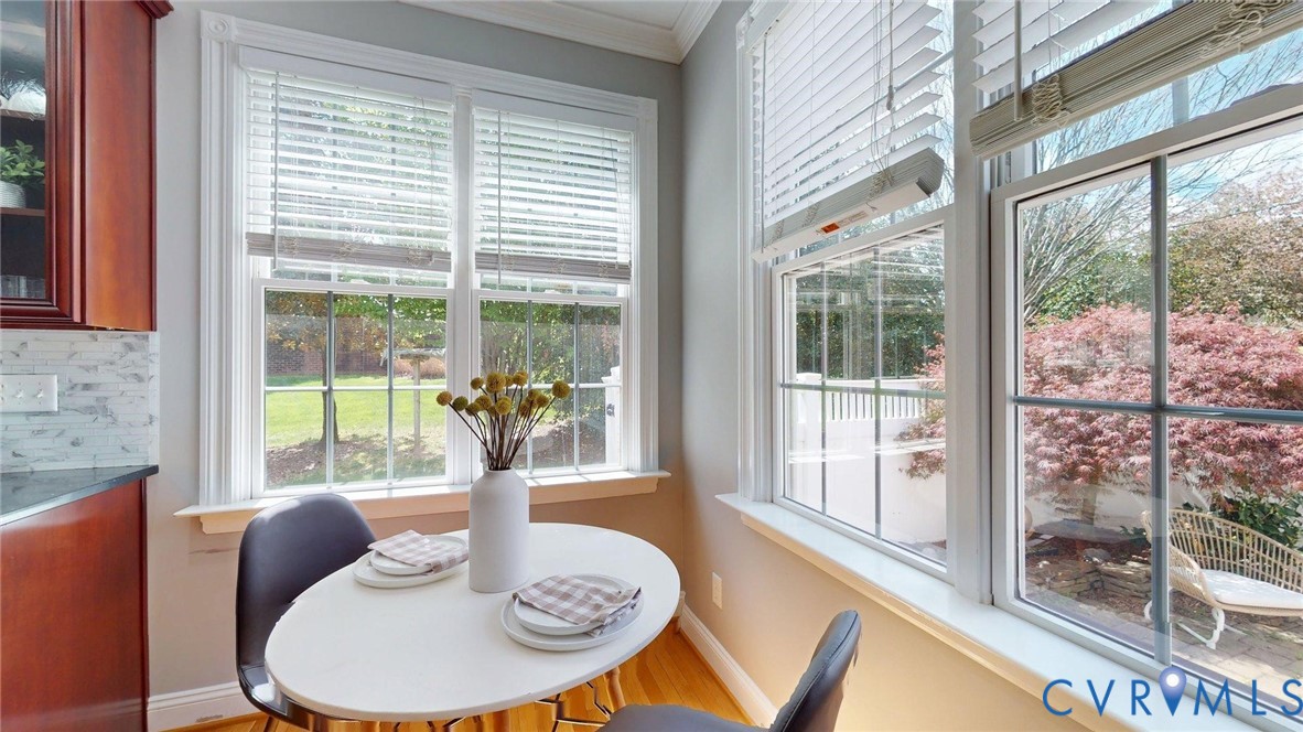 9012 Amberhill Loop North Chesterfield, VA 23236 - Photo 8 of 30 a dining room with furniture a livingroom and glass windows