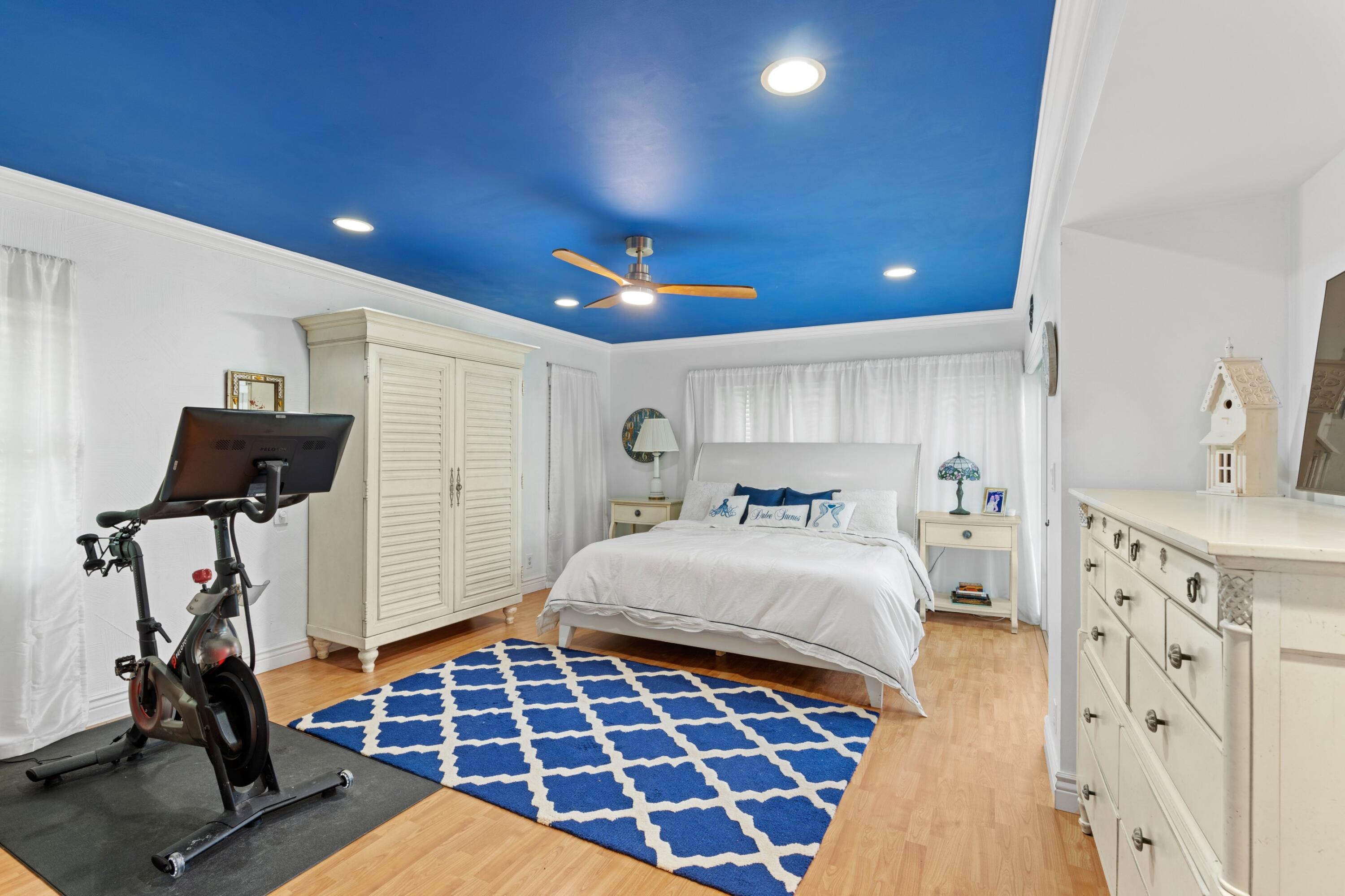 10238 Crosswind Road Boca Raton, FL 33498 - Photo 16 of 42 a bedroom with a bed and a walk in closet