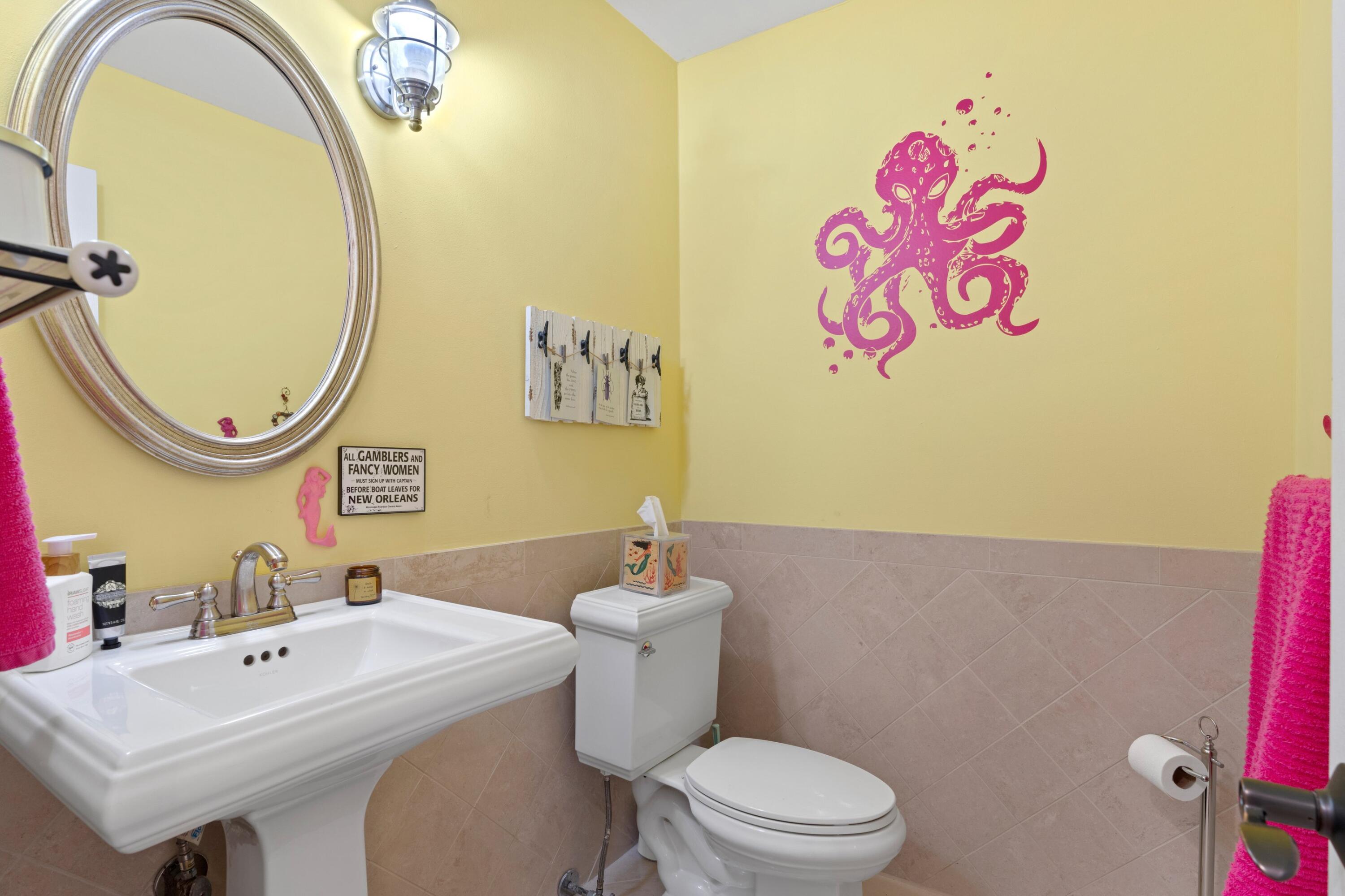 10238 Crosswind Road Boca Raton, FL 33498 - Photo 24 of 42 a bathroom with a sink mirror vanity and toilet