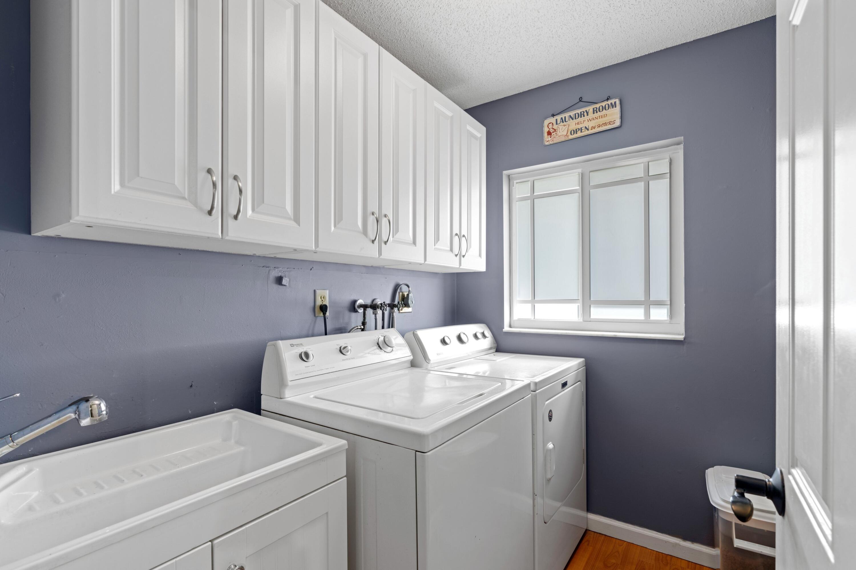 10238 Crosswind Road Boca Raton, FL 33498 - Photo 25 of 42 a utility room with dryer and washer