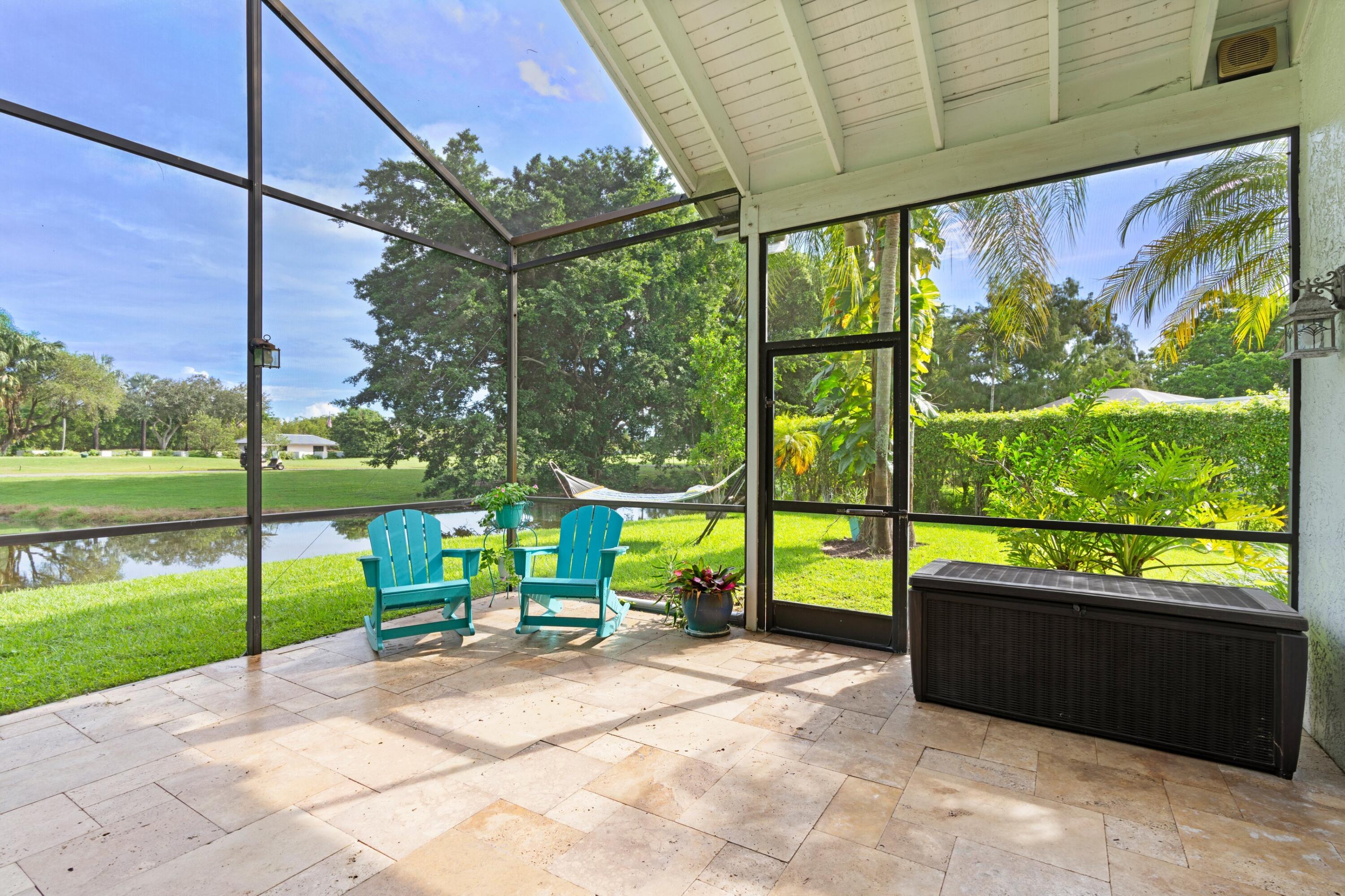 10238 Crosswind Road Boca Raton, FL 33498 - Photo 27 of 42 a view of a porch with a back yard