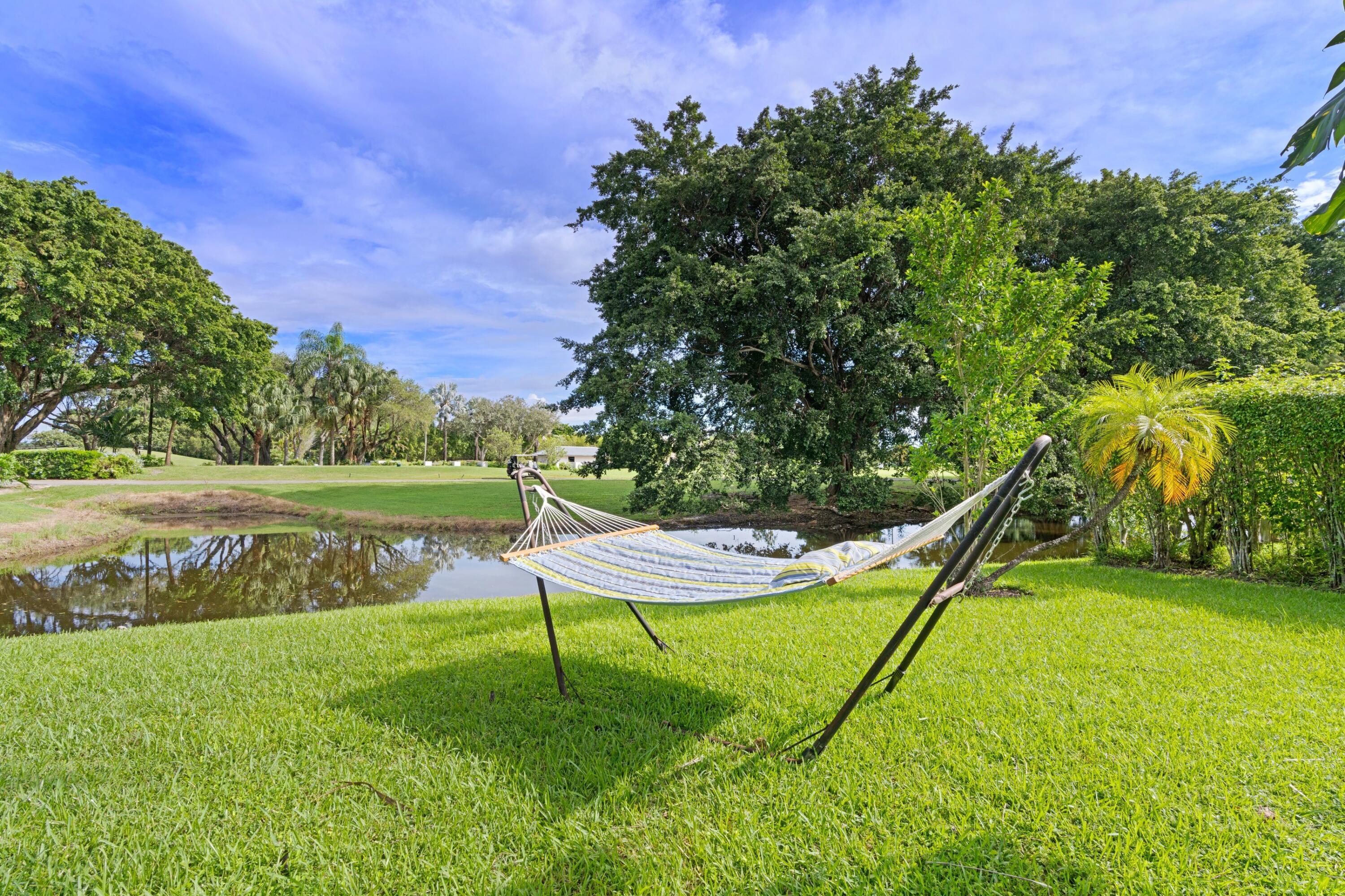 10238 Crosswind Road Boca Raton, FL 33498 - Photo 28 of 42 a garden with trees in the background