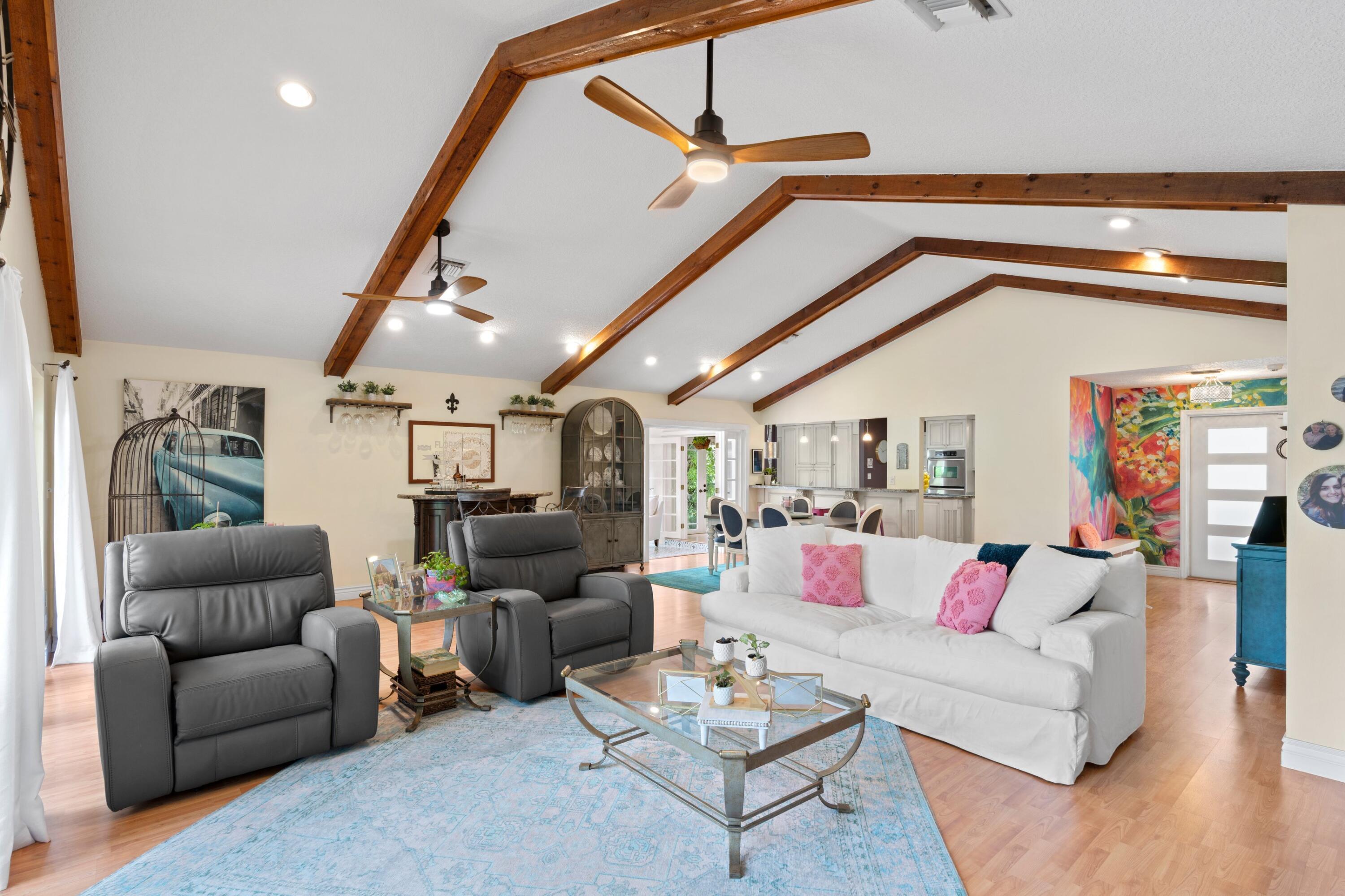 10238 Crosswind Road Boca Raton, FL 33498 - Photo 3 of 42 a living room with furniture and wooden floor