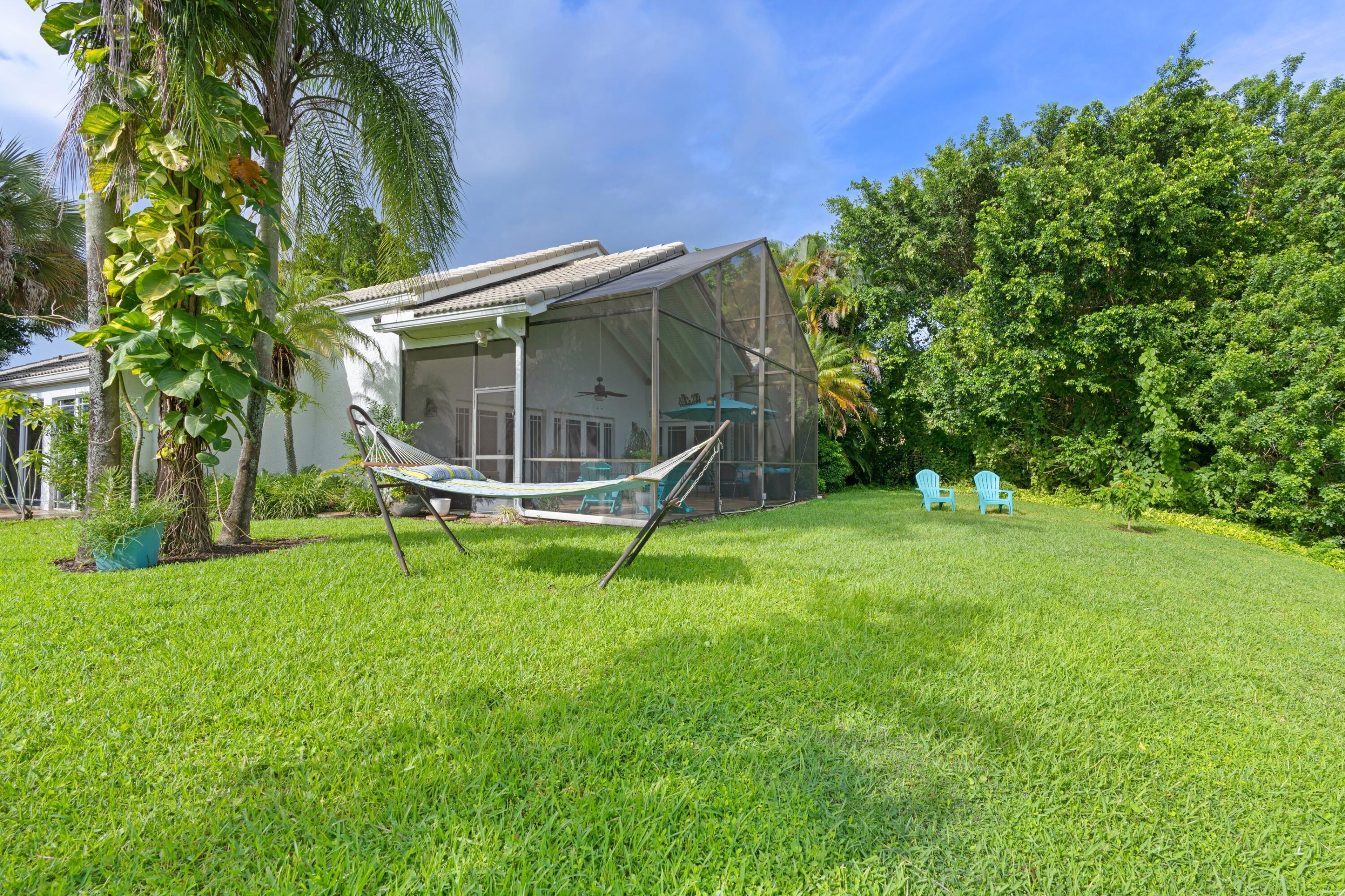 10238 Crosswind Road Boca Raton, FL 33498 - Photo 31 of 42 a garden with trees in front of it