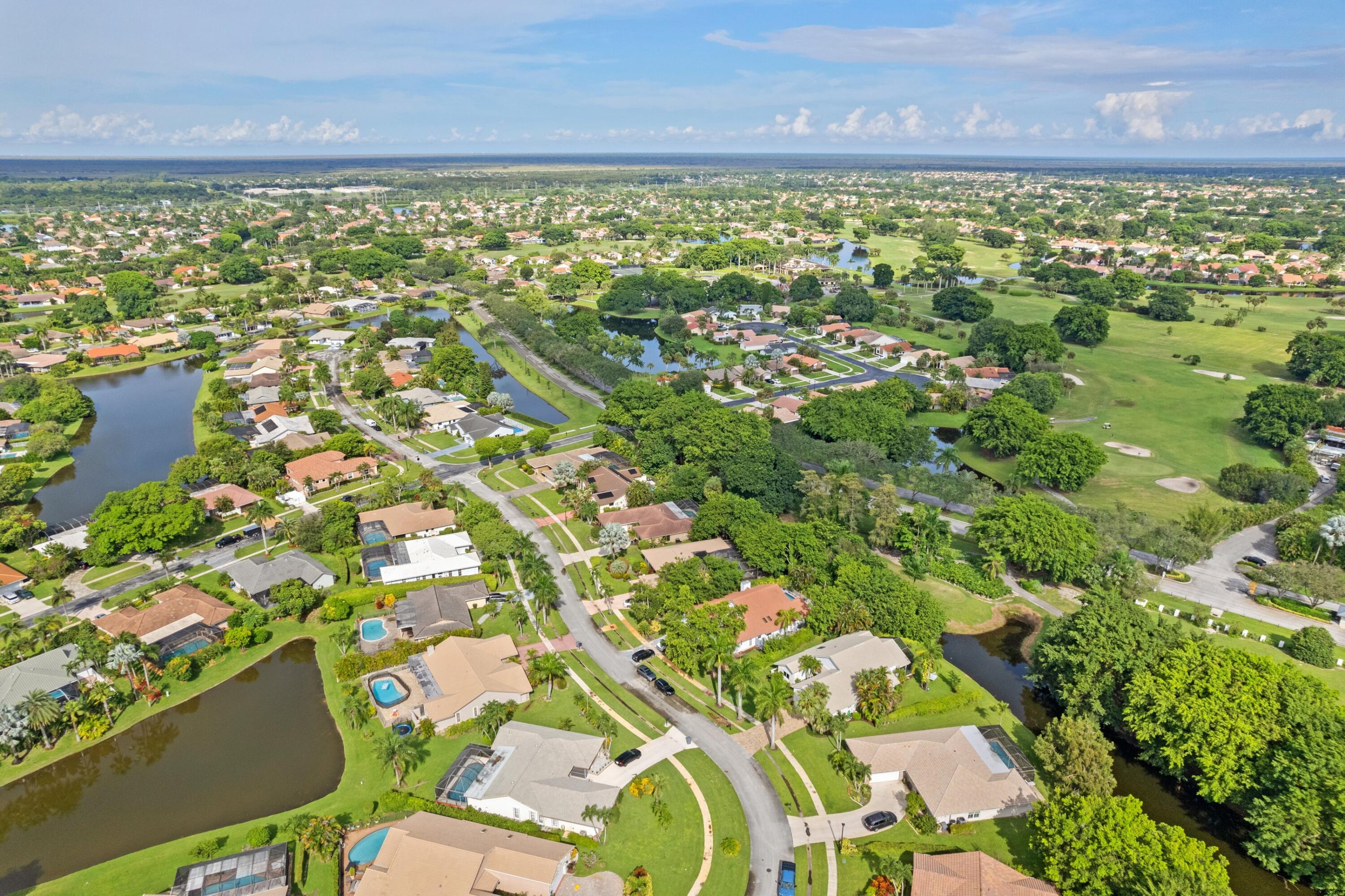 10238 Crosswind Road Boca Raton, FL 33498 - Photo 37 of 42 a view of a lake with outdoor space