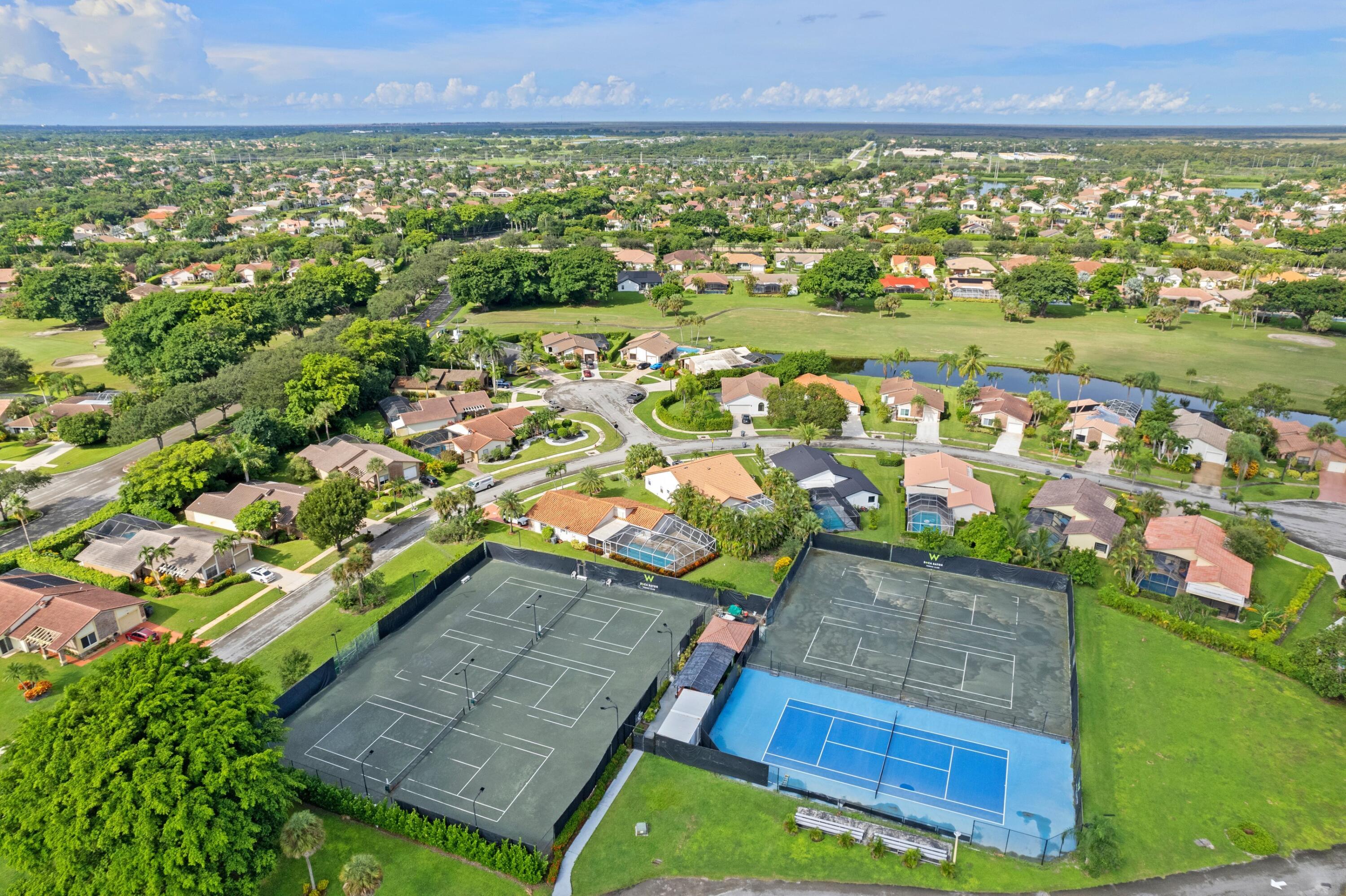 10238 Crosswind Road Boca Raton, FL 33498 - Photo 38 of 42 an aerial view of residential houses with outdoor space and trees