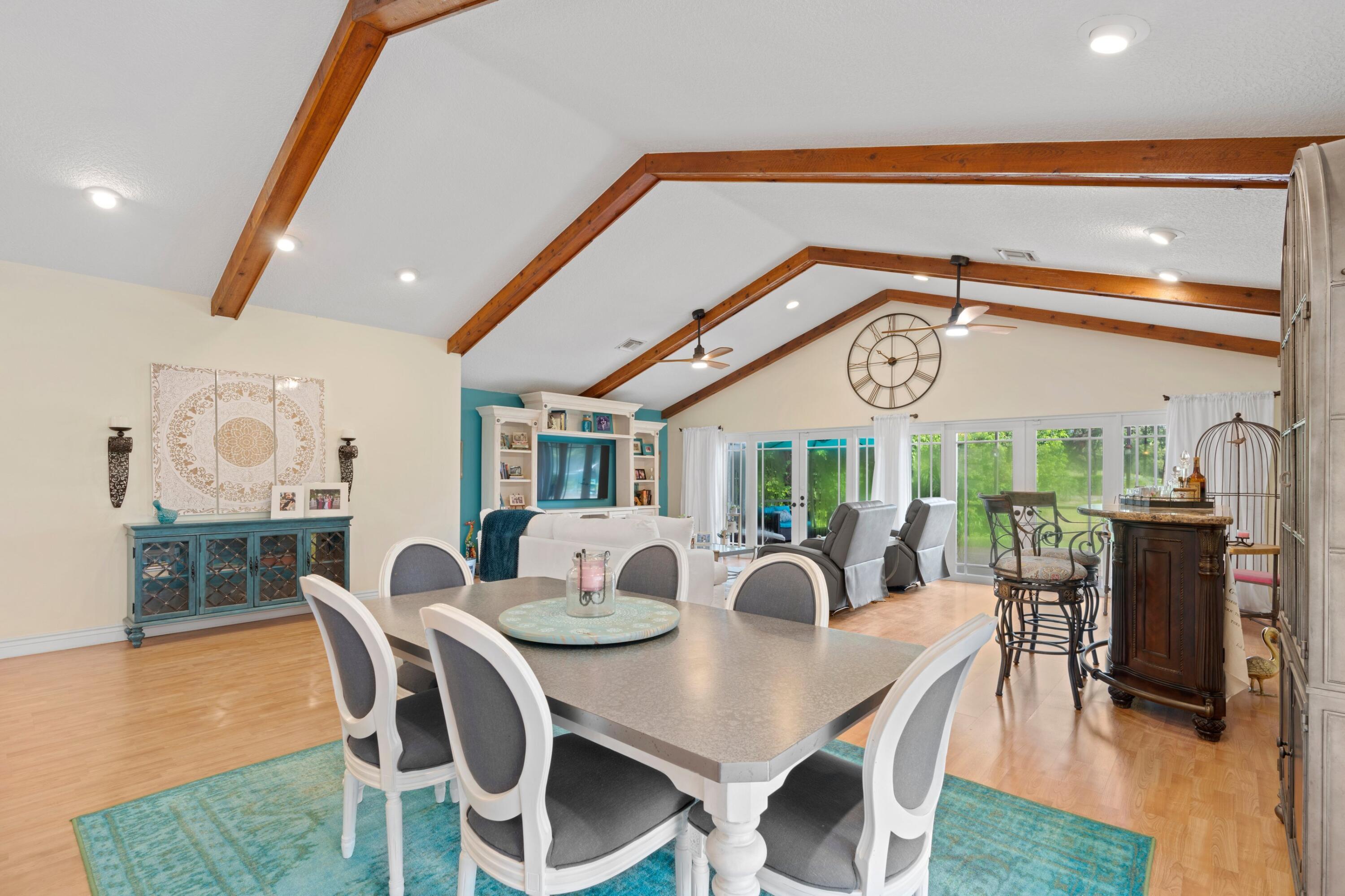 10238 Crosswind Road Boca Raton, FL 33498 - Photo 6 of 42 a view of a dining area with furniture window and wooden floor