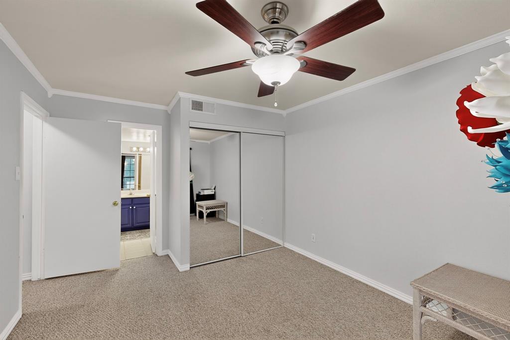 324 West Harwood Road, Unit A Hurst, TX 76054 - Photo 26 of 27 an empty room with closet and a chandelier fan