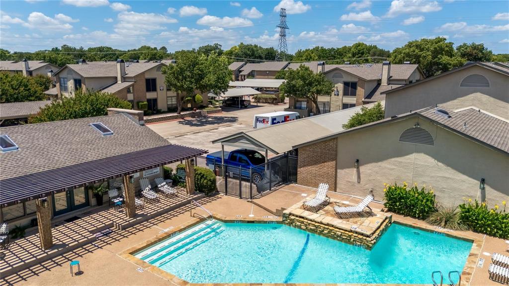 324 West Harwood Road, Unit A Hurst, TX 76054 - Photo 4 of 27 an aerial view of a house with swimming pool patio and outdoor seating