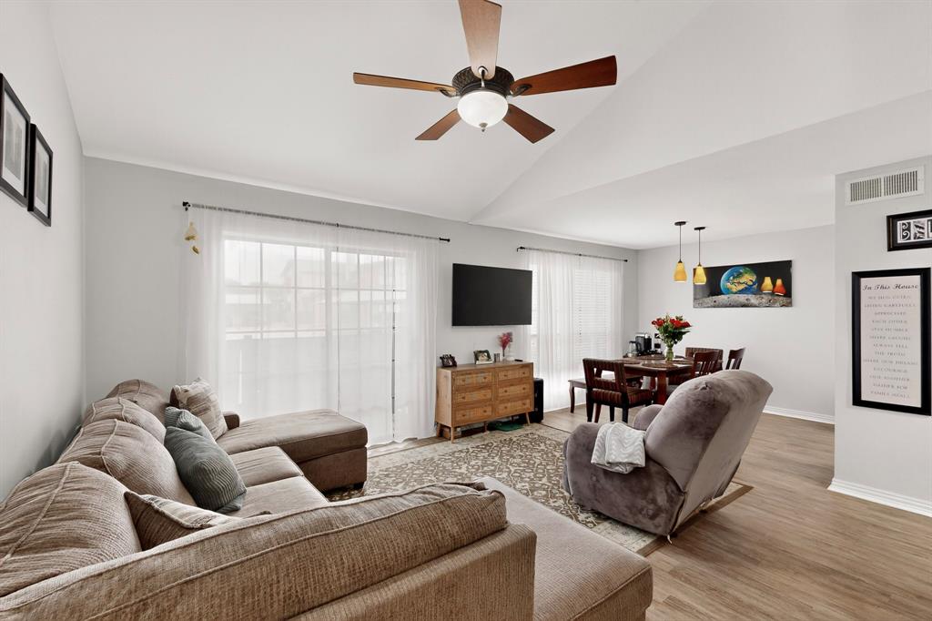 324 West Harwood Road, Unit A Hurst, TX 76054 - Photo 8 of 27 a living room with furniture and a flat screen tv
