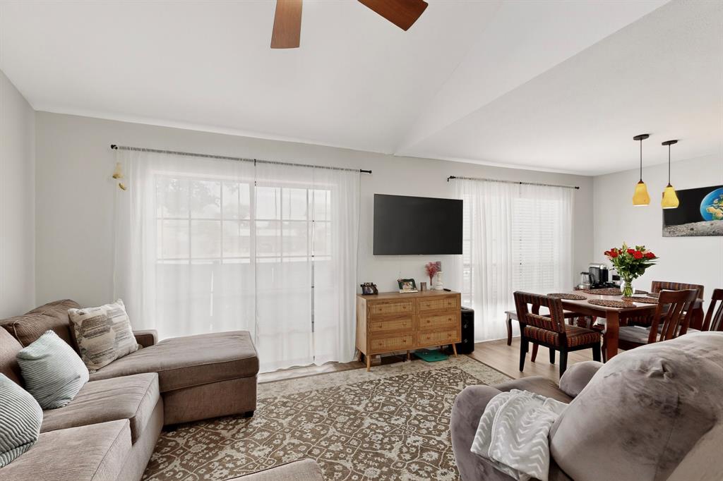 324 West Harwood Road, Unit A Hurst, TX 76054 - Photo 9 of 27 a living room with furniture and a flat screen tv