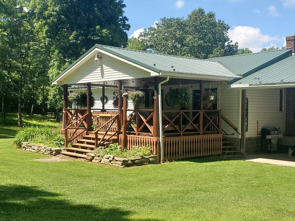 370 Braddock Road Farmington, PA 15437 - Photo 37 of 46 a view of a house with backyard and sitting area