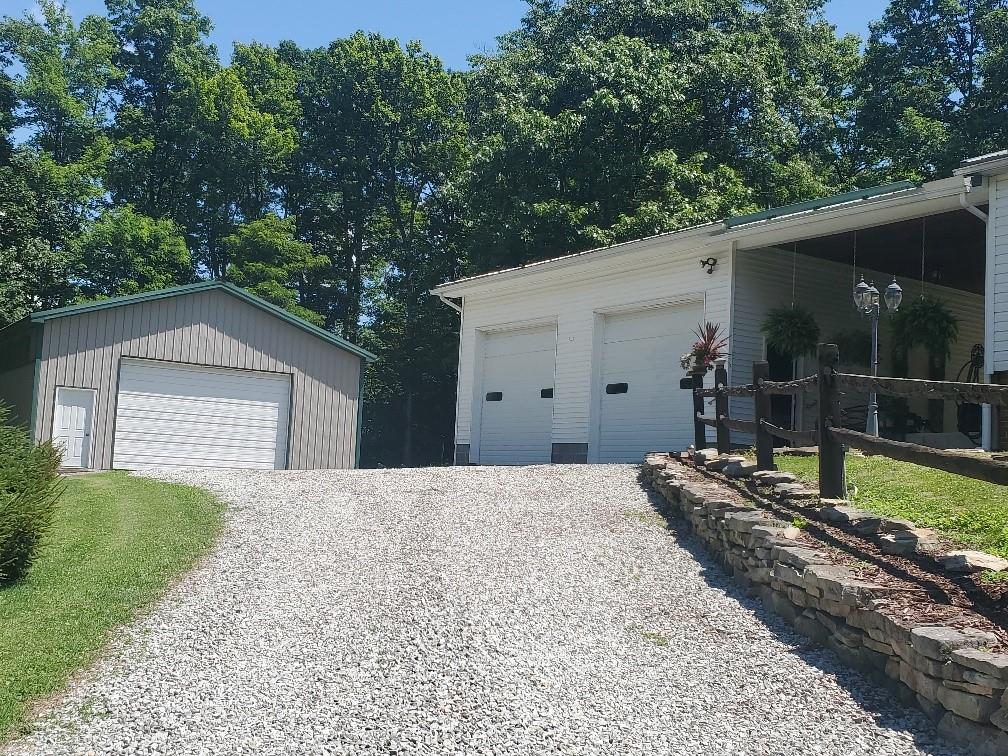 370 Braddock Road Farmington, PA 15437 - Photo 44 of 46 a front view of a house with garden