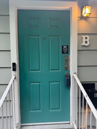 a view of a door and wooden floor