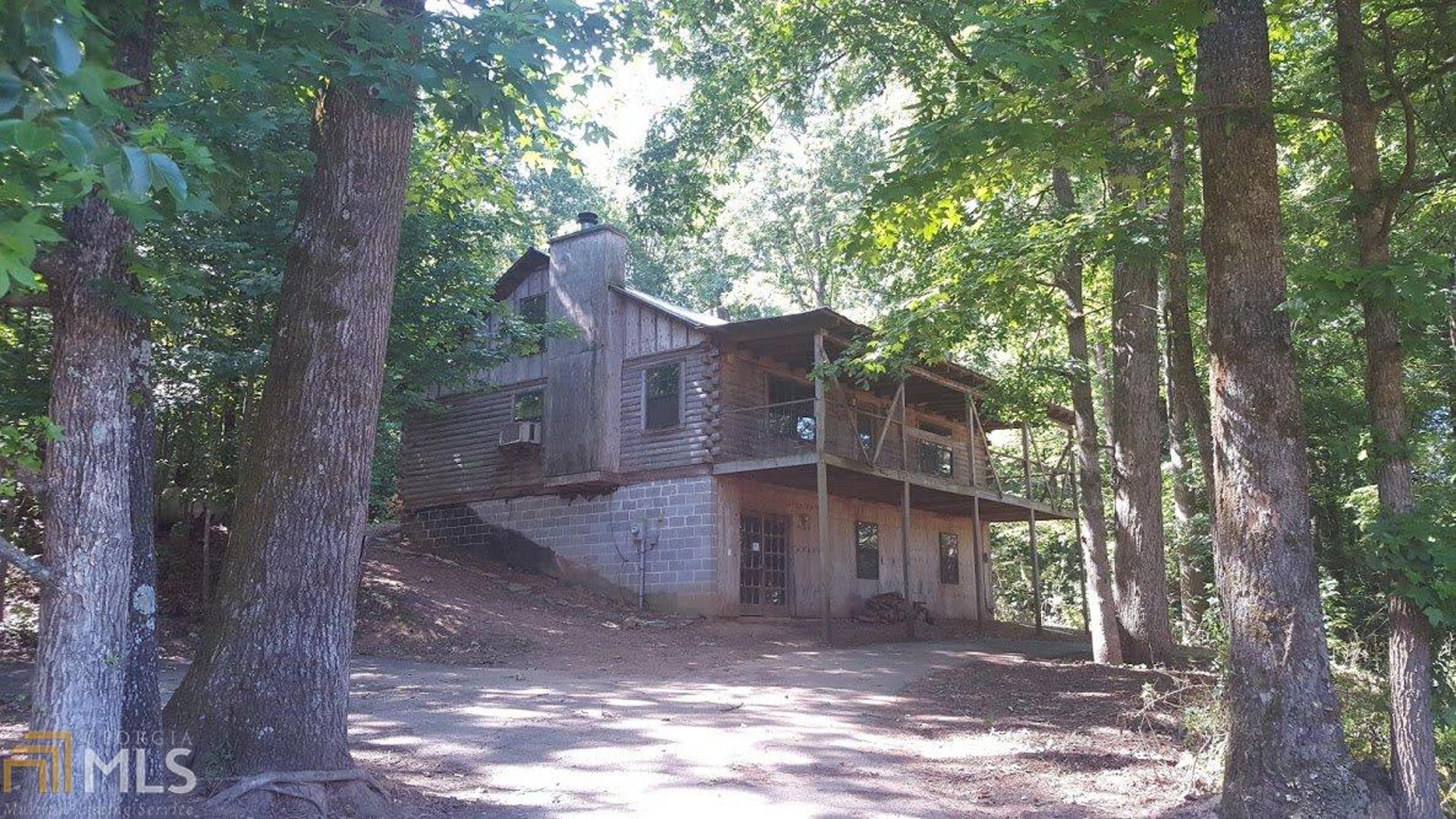 1570 Leatherford Road Cleveland, GA 30528 - Photo 1 of 1 a view of a house with a tree in front of it