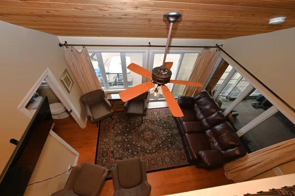 a bedroom with furniture and a chandelier