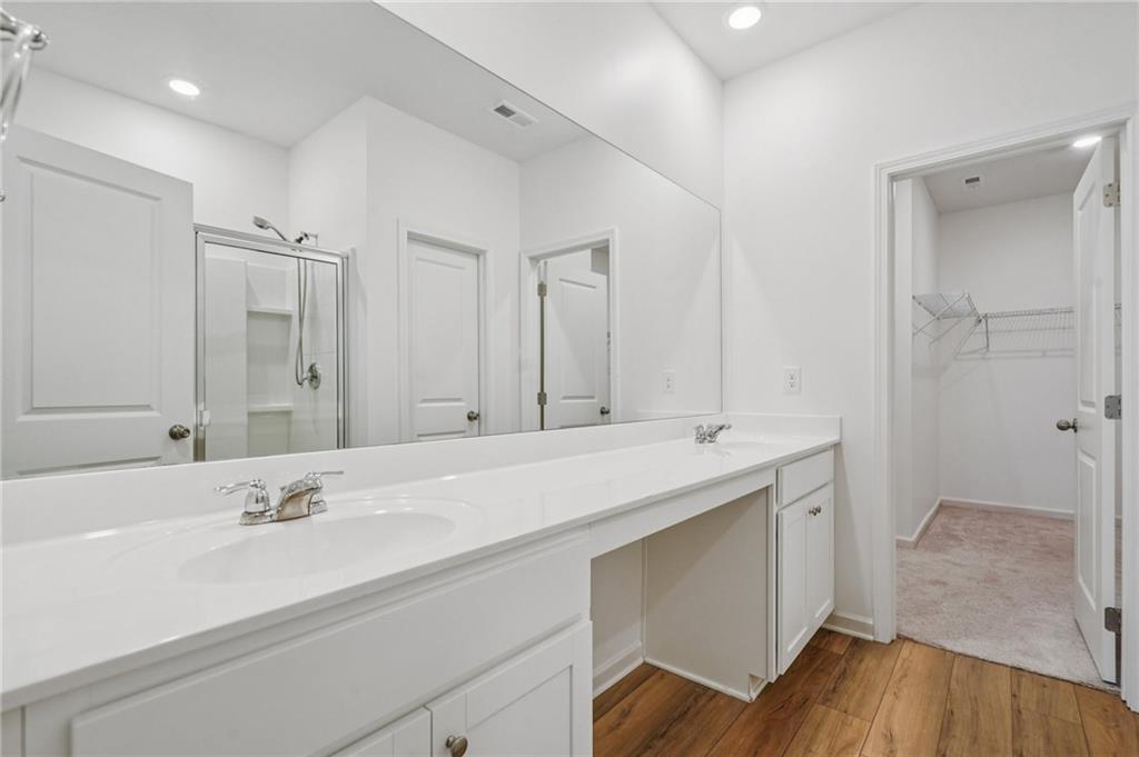3853 Rustic Barn Way Loganville, GA 30052 - Photo 12 of 22 a bathroom with a sink and a mirror