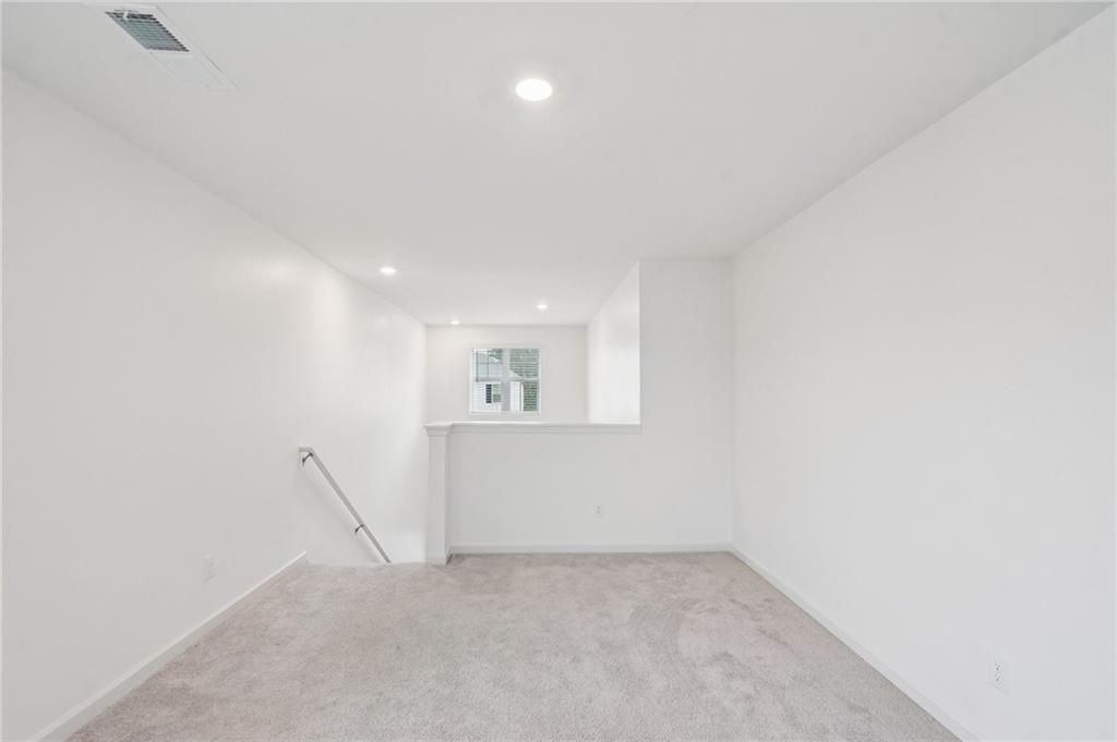 3853 Rustic Barn Way Loganville, GA 30052 - Photo 14 of 22 a view of an empty room