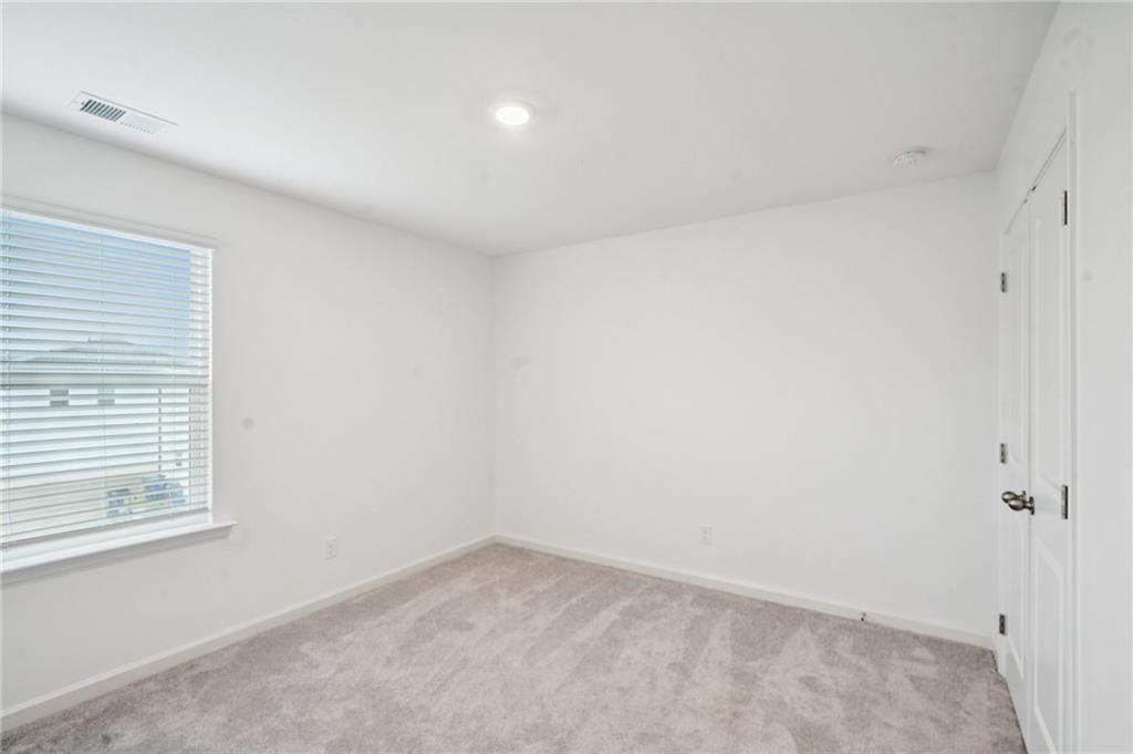 3853 Rustic Barn Way Loganville, GA 30052 - Photo 19 of 22 a view of an empty room