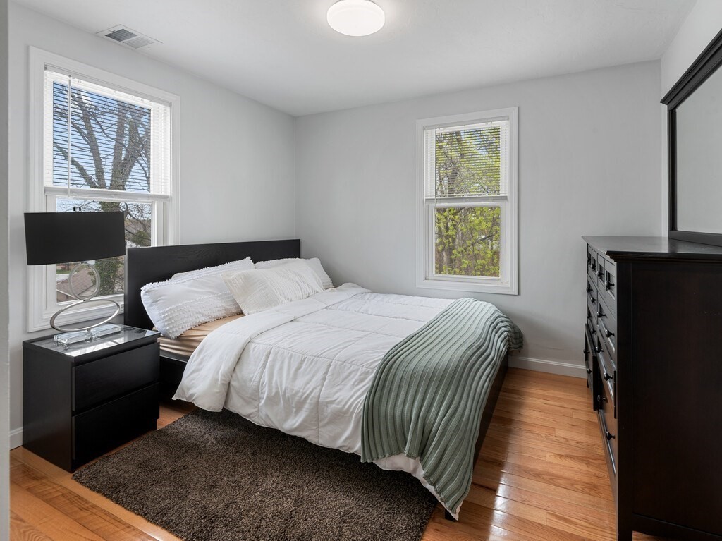 2 Stringer Dam Road Shrewsbury, MA 01545 - Photo 24 of 35 a bedroom with a bed and wooden floor