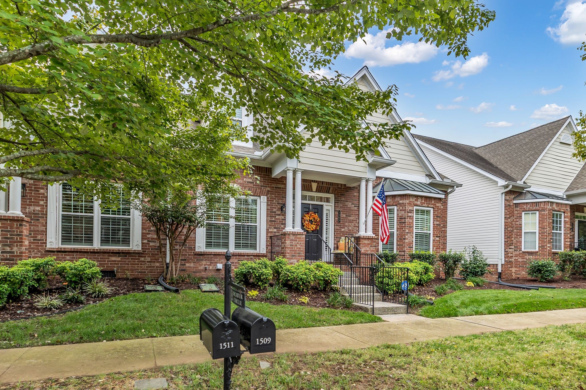 1509 Decatur Circle Franklin, TN 37067 - Photo 2 of 40 a front view of a house with a yard and potted plants