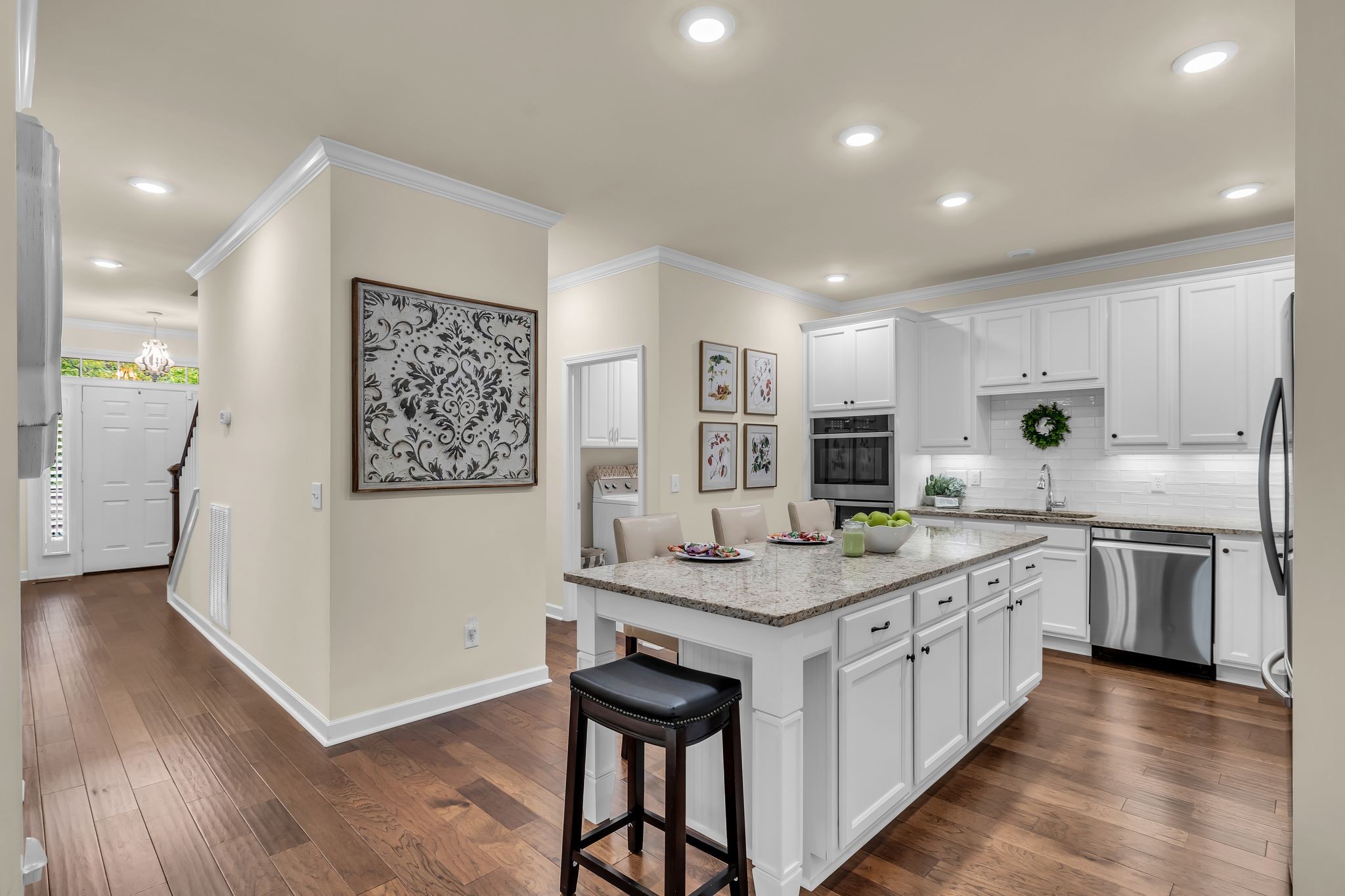 1509 Decatur Circle Franklin, TN 37067 - Photo 9 of 40 a kitchen with stainless steel appliances granite countertop a sink stove and refrigerator