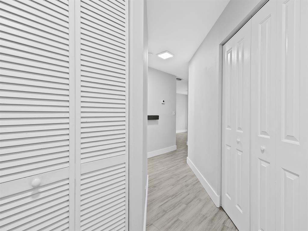 3208 Northeast 7th Street, Unit C Pompano Beach, FL 33062 - Photo 7 of 10 a view of a hallway with a window