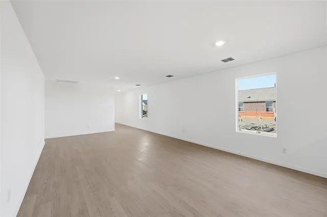 an empty room with a empty space and window