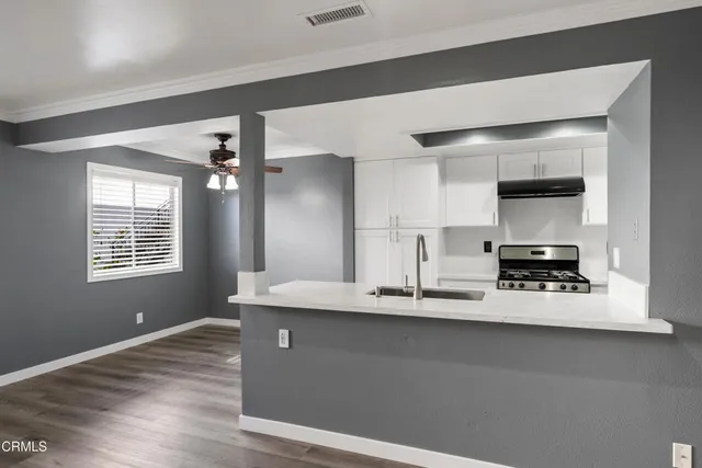a view of a livingroom with wooden floor