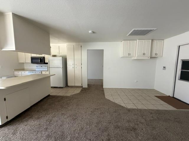 2601 Temperate Court Modesto, CA 95358 - Photo 15 of 24 a view of a kitchen with a sink cabinets and a window