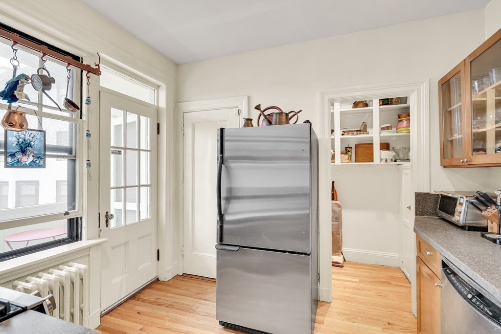 321 Tappan Street, Unit 3 Brookline, MA 02445 - Photo 14 of 39 a kitchen with a refrigerator and a stove