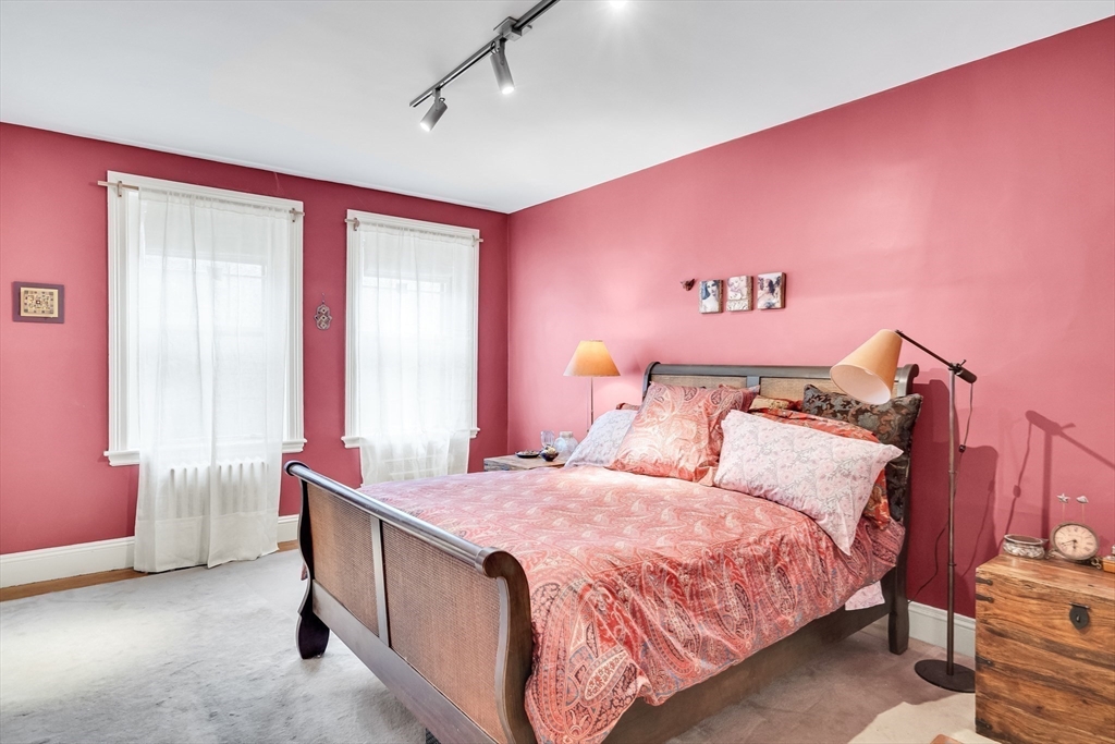 321 Tappan Street, Unit 3 Brookline, MA 02445 - Photo 22 of 39 a bed room with a bed and a chair