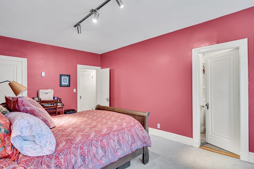 321 Tappan Street, Unit 3 Brookline, MA 02445 - Photo 25 of 39 a bedroom with a bed and a mirror